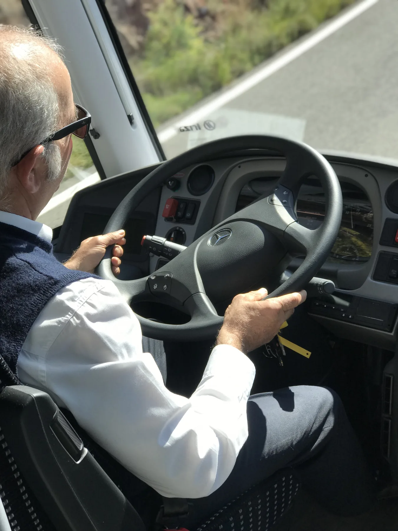 Conductor de Transunion al volante de un autocar